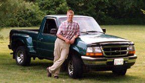 senior student photo in the park with car